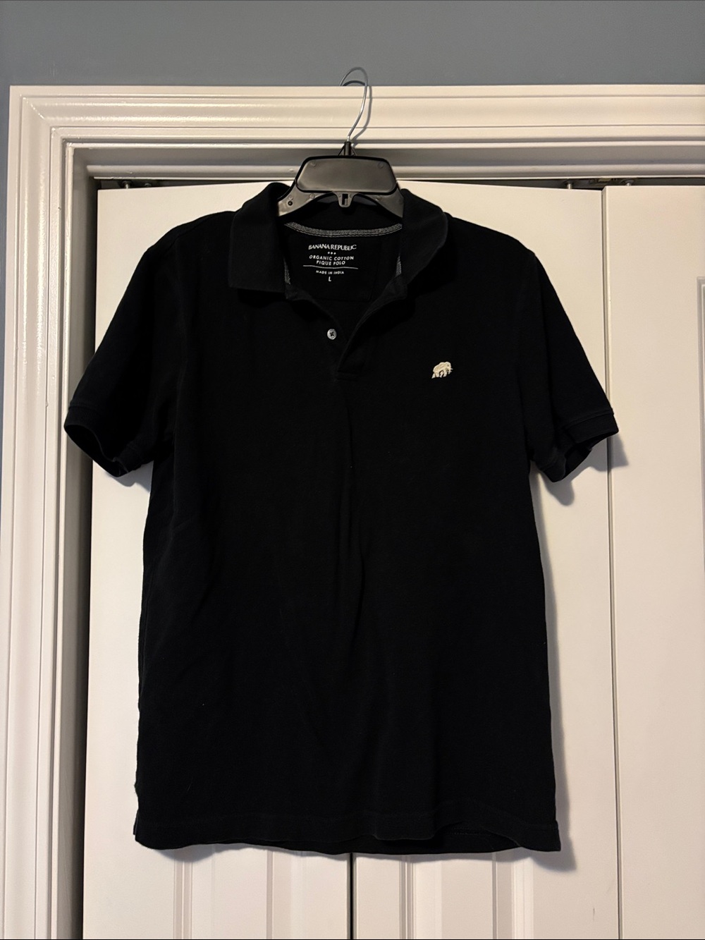 Banana Republic organic cotton Black Polo with Small Ivory Elephant Emblem